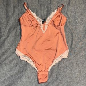 Pink lacy bodysuit